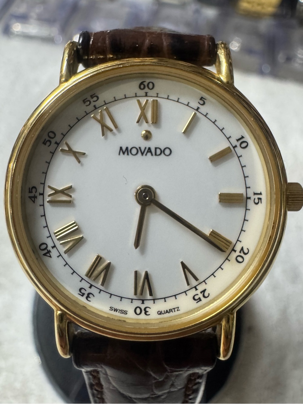 #120 Movado Gold Tone Case White Dial Watch with Brown Leather Strap